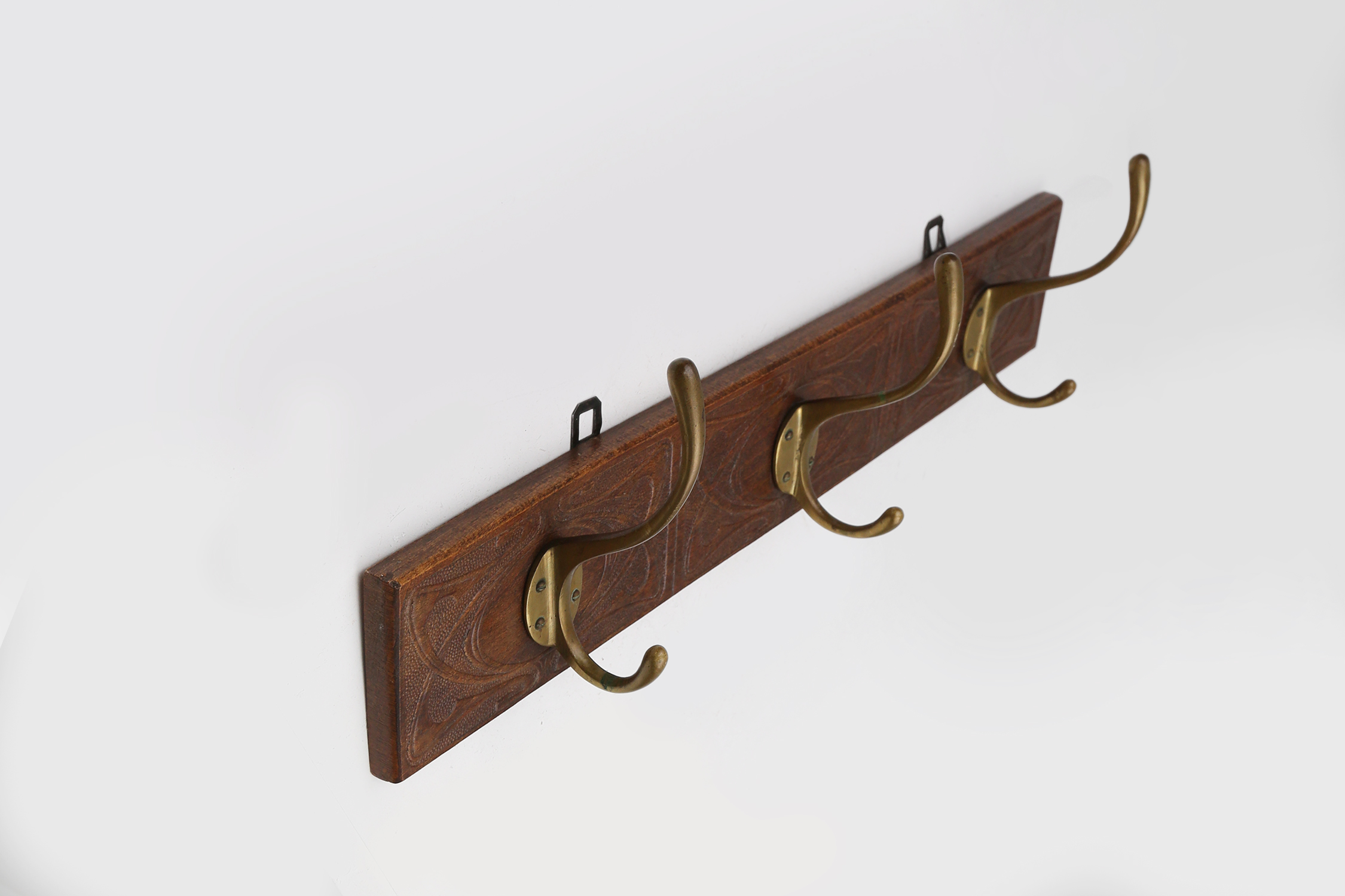 Art Nouveau wall coat rack in carved wood with brass, France ca. 1910thumbnail